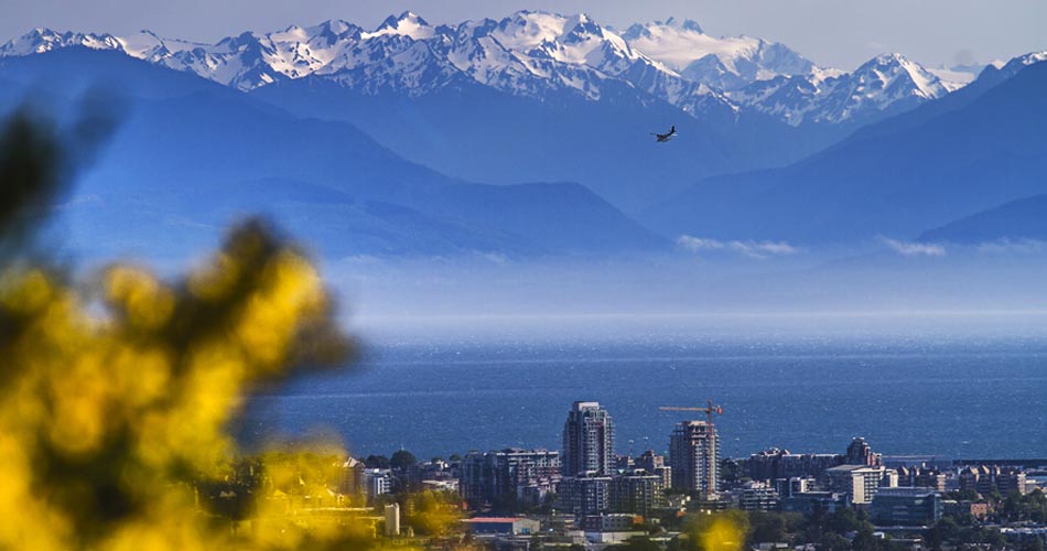 Image of Victoria in British Columbia, Canada with snow-capped mountains in the background