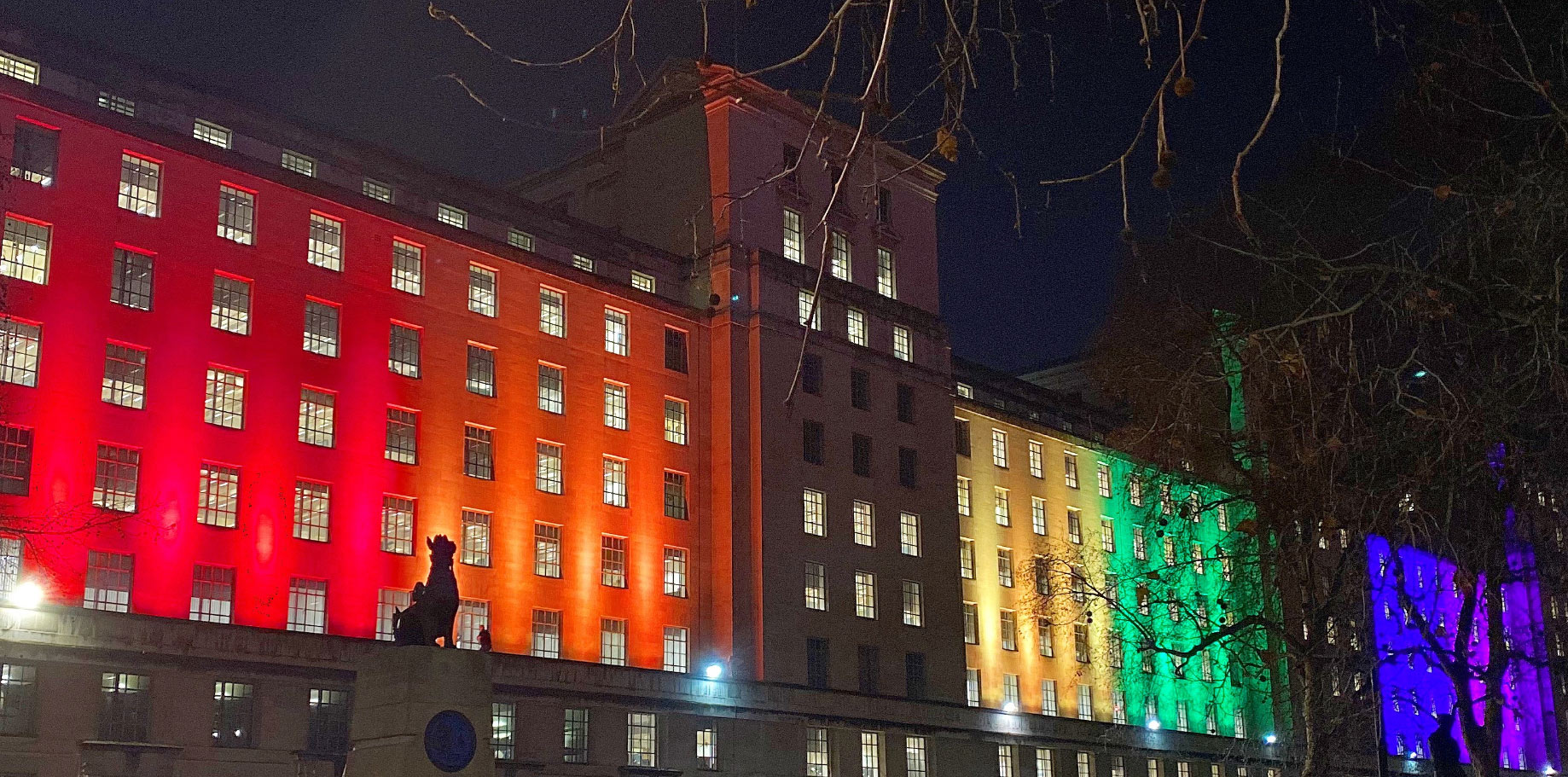 Image of the Ministry of Defence in London, lit up in different colours, at night, to illustrate Vercity's SPV management work.